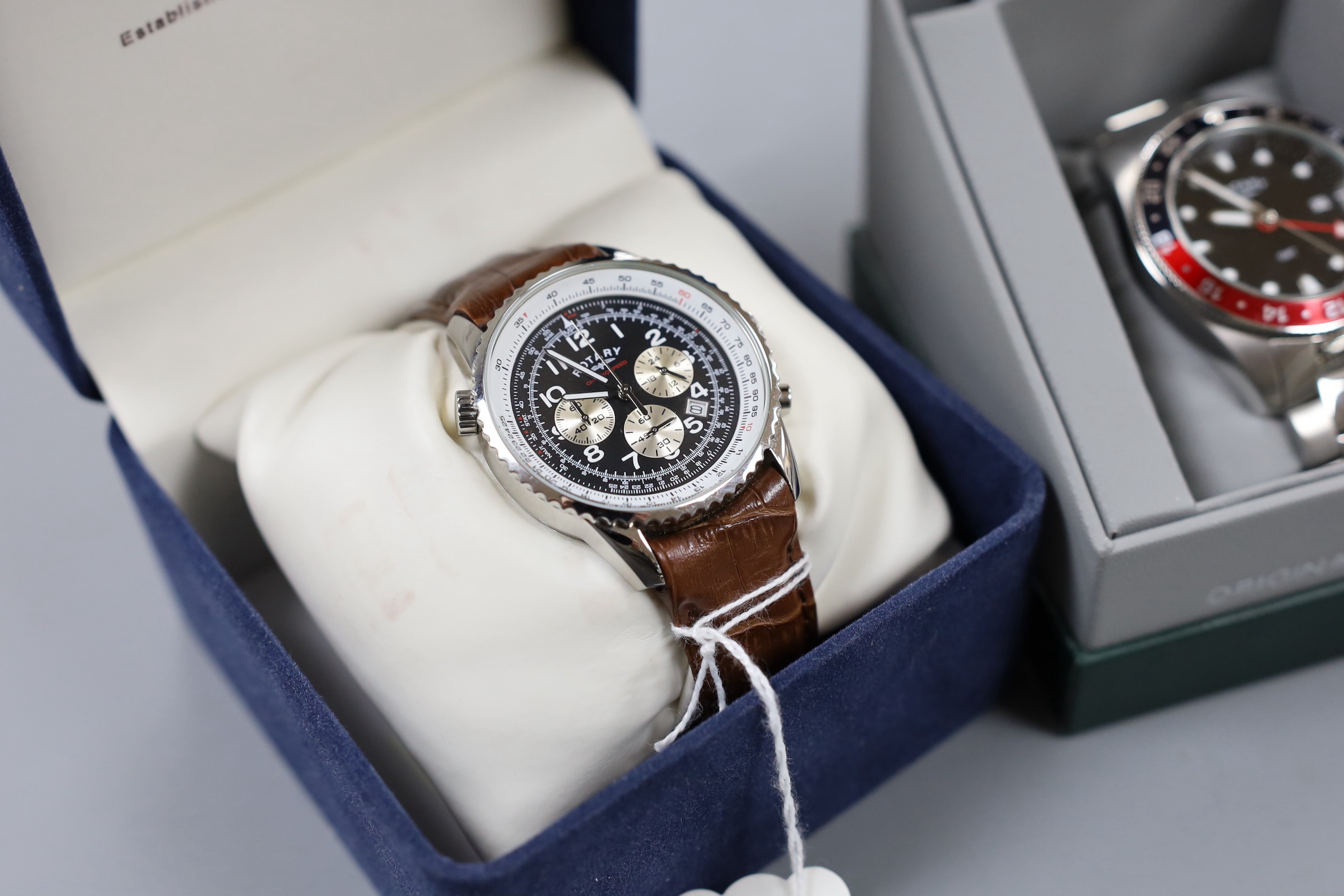Two gentleman's modern stainless steel Rotary quartz wrist watches, model GMT and Chronospeed, both with boxes.